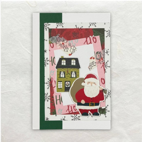Verschillend designpapier, een sticker van een kersthuis en een chipboard van de kerstman maken deze kerstkaart compleet.