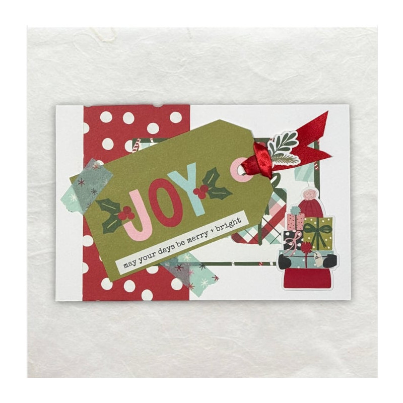 Een tag met rood lintje waar groot het woord Joy op is geschreven, maakt duidelijk waar het omdraait in de periode rondom kerst.