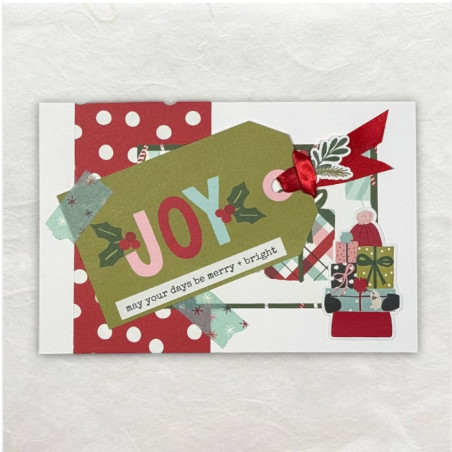 Een tag met rood lintje waar groot het woord Joy op is geschreven, maakt duidelijk waar het omdraait in de periode rondom kerst.