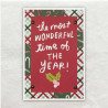 Kleine stukjes Kerstpapier is her en der op de achterzijde van de kaart geplakt. De rechthoek is vastgezet Hot Fix Deco.