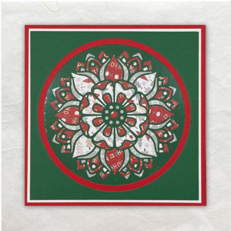 De Mandala is meerdere keren gestanst uit designpapier en in de oorspronkelijke vorm teruggelegd en vastgeplakt.