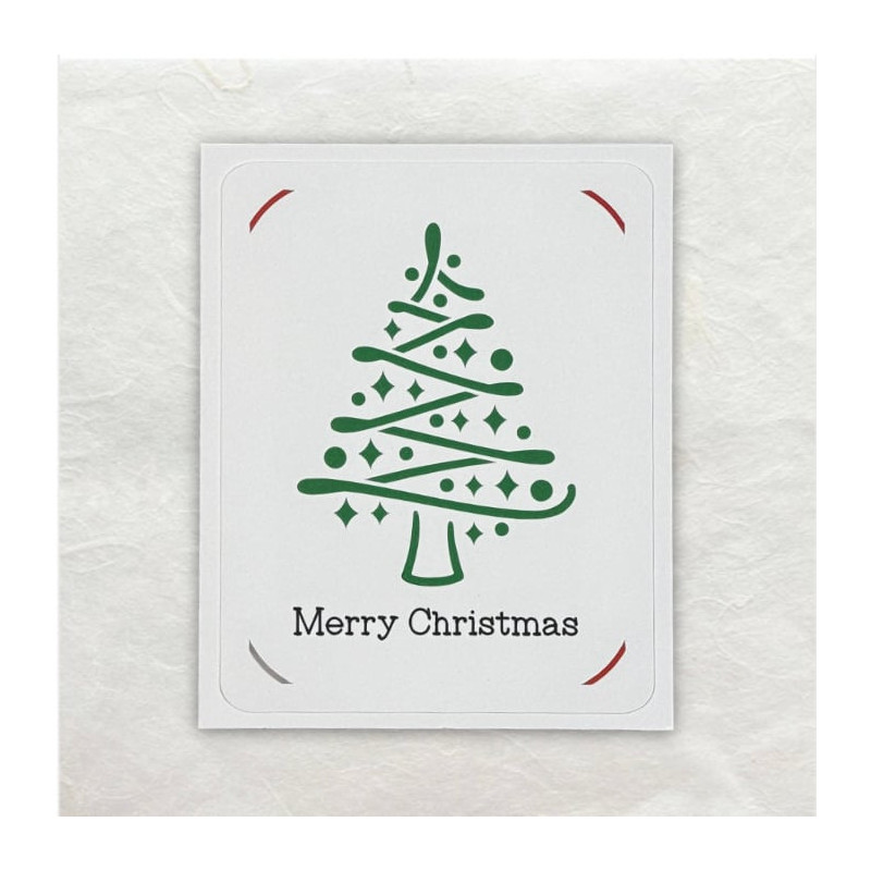 Deze kerstboom met versieringen is uitgesneden met de Cricut.  De tekst is eveneens door deze machine geschreven.