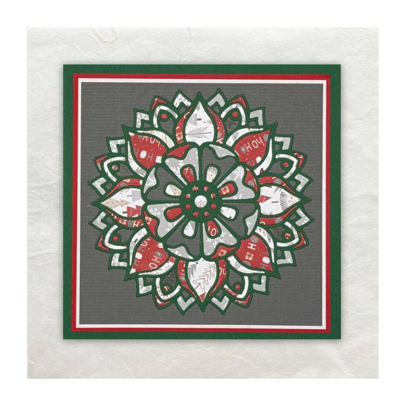 De Mandala is meerdere gestanst. Daarna zijn de stukjes designpapier in het frame van de mandala ingelegd.