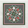 De Mandala is meerdere gestanst. Daarna zijn de stukjes designpapier in het frame van de mandala ingelegd.