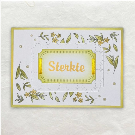 Op het frame zijn bloementakjes gestempeld en gekleurd. Het woord sterkte is een rub-on.