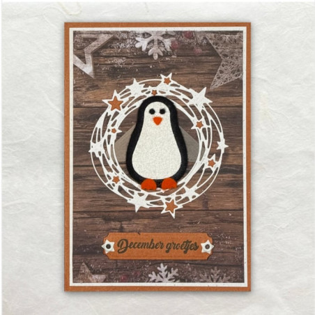 Het ronde sterrenframe is gestanst en de kleine oranje sterretjes zijn erin gelegd. De achtergrond is designpapier.