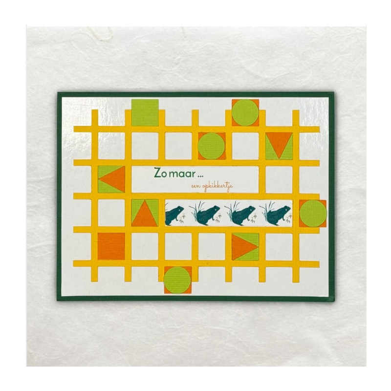 Het frame is uitgesneden met de Cricut en ingelegd met geometrische figuren. De tekst is met de handprinter geprint.