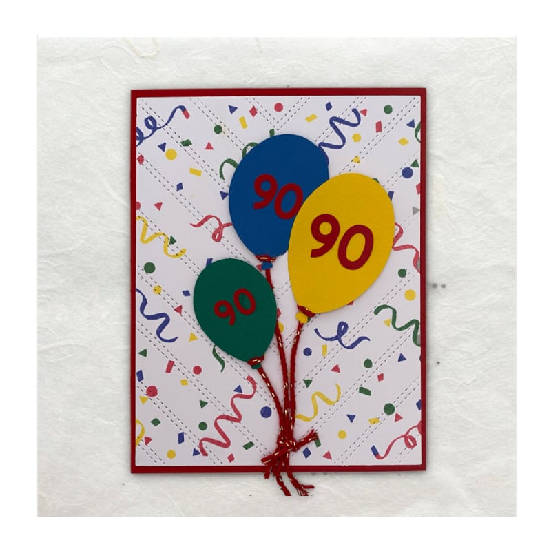 De achtergrond met de feest slingers is rond gestempeld. De ballonnen zijn uitgesneden met de Cricut.